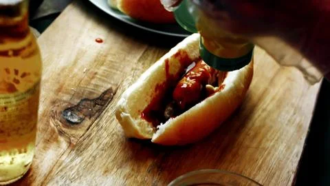 Assembling BBQ Bratwurst in Soft Buns — Kitchen Counter Scene Stock Photos
