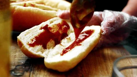 Assembling BBQ Bratwurst in Soft Buns — Hands in Action Stock Photos