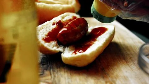 Assembling BBQ Bratwurst in Soft Buns — Three Quarter View Stock Photos