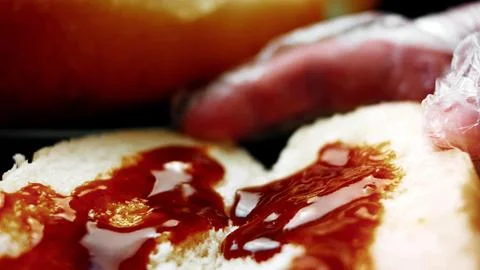 Assembling BBQ Bratwurst in Soft Buns — Low Side Angle Stock Photos