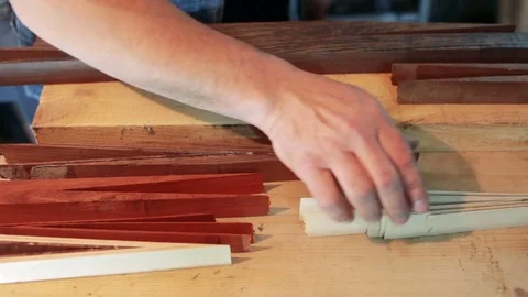 Assembling a billiard cue. Thin wood Stock Footage 75950973