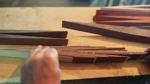 Assembling a billiard cue. Thin wood Stock Footage 75951653