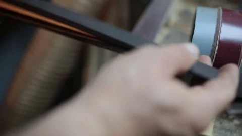 Assembling a billiard cue. Thin wood Stock Footage 76443628