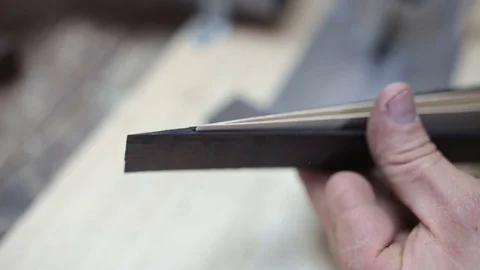 Assembling a billiard cue. Thin wood Stock Footage 76443819