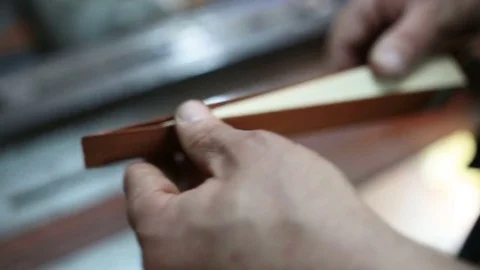 Assembling a billiard cue. Thin wood Stock Footage 76444532
