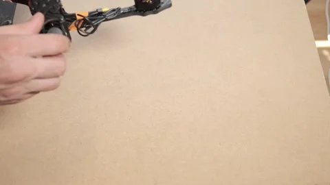 Assembling Carbon Fiber FPV Racing Drone Frame by Hand Stock Footage 328649851