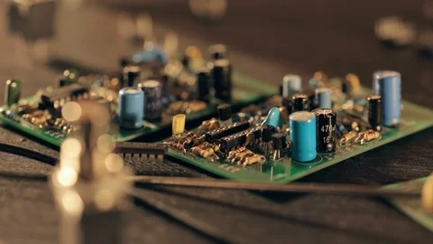 Assembling a circuit board. Putting microcircuit on PCB with tweezers Video stock 97603690