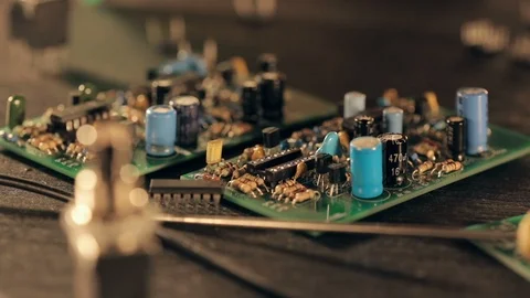 Assembling a circuit board. Putting microcircuit on PCB with tweezers Vídeos de archivo 97603695