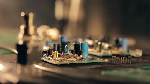 Assembling a circuit board. Putting microcircuit on PCB with tweezers Video stock 97603732