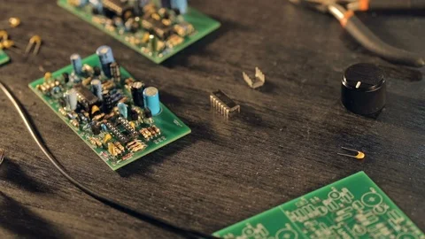 Assembling a circuit board. Putting microcircuit on PCB with tweezers Stockbeeldmateriaal 97603789