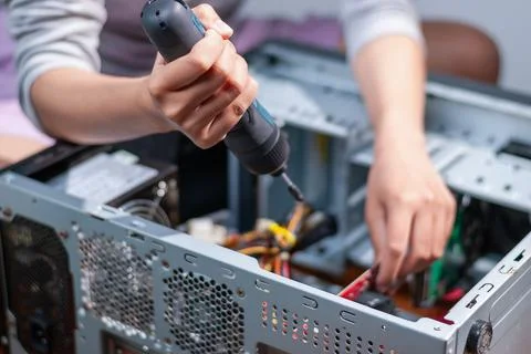 Assembling a computer system home workshop diy project indoor close-up tech.. Stock Photos