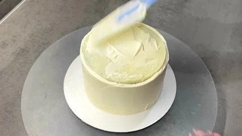 Assembling a cottage cheese pie on a gray table. cake ingredients. Stock Footage 244516494