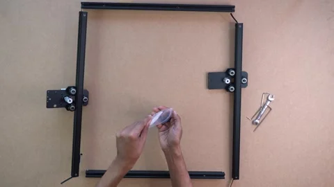 Assembling desktop laser engraver frame step by step with visible tools and 스톡 동영상 328475360