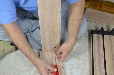 Assembling a Drawer with a Screwdriver Stock Photos
