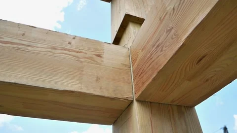 Assembling the frame of building made of wooden beams close up Stock Footage 220611218