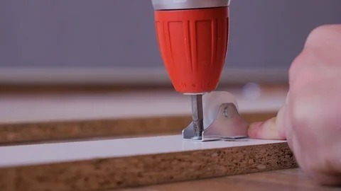 Assembling the furniture, fixing the wheels. Close up. Stock Footage 108610057