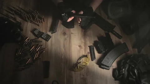 Assembling the gun. Military ammunition. Weapon care. Top view. Stock-Footage 230940231