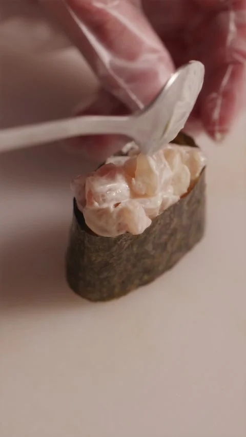 Assembling gunkan sushi with fresh chopped sea bass fish 스톡 동영상 337119130