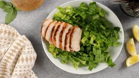 Assembling healthy salad with grilled chicken and chickpeas Stock Footage 242524359