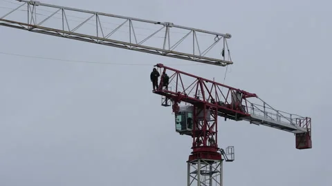 Assembling of high-rise crane against sky background Video stock 153969546