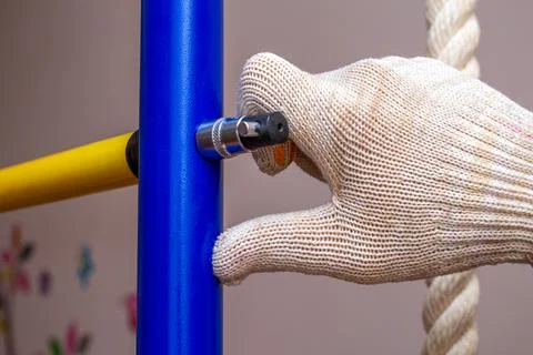 Assembling installing home gymnastic wall bars on the floor. Sport gym home c Stock Photos