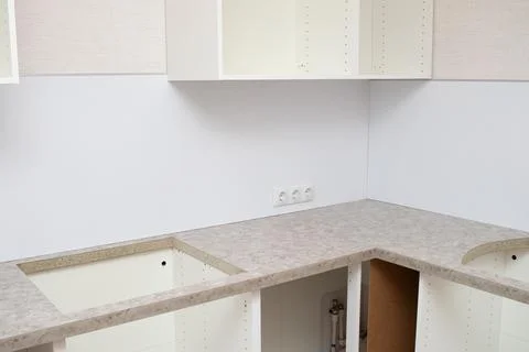 Assembling Kitchen Cabinets. Renovated kitchen interior Stock Photos