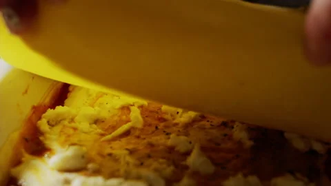 Assembling lasagna with wide, flat sheets of yolk pasta dough, cooking Stock Footage 167530261