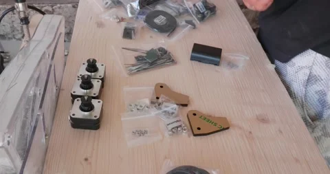 Assembling a laser engraver from an assembly kit sent by the manufacturer. Sc Video stock 156889265