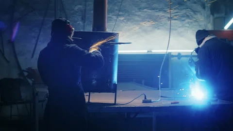 Assembling metal structures, making a homemade heater by a professional worker Stock Footage 183460206