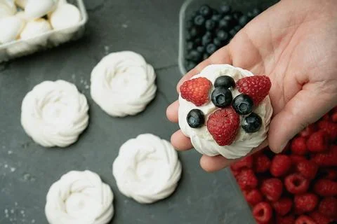 Assembling mini pavlovas Stock Photos