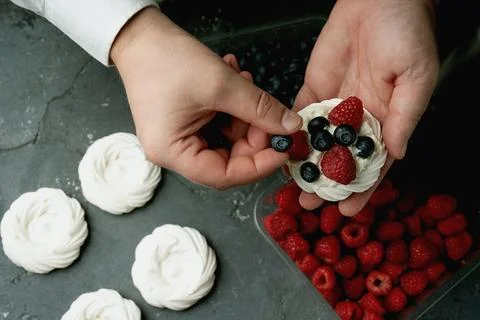 Assembling mini pavlovas Stock Photos