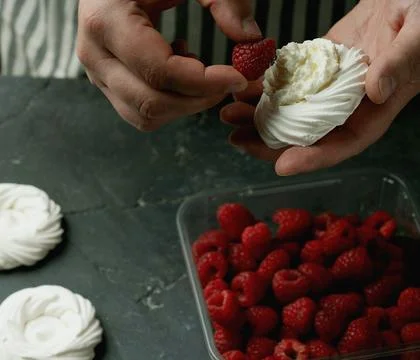 Assembling mini pavlovas Stock Photos