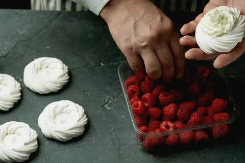 Assembling mini pavlovas Stock Photos