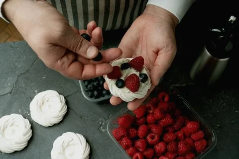 Assembling mini pavlovas Stock Photos