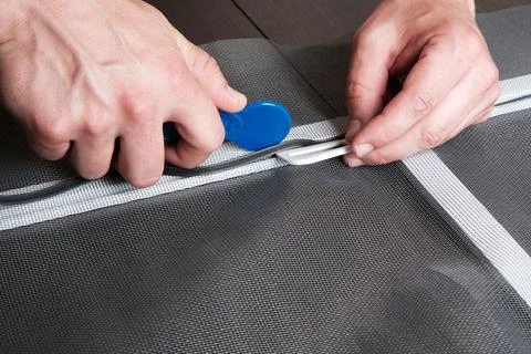 Assembling  mosquito net for  window, installing  seal in an aluminum profile Фото