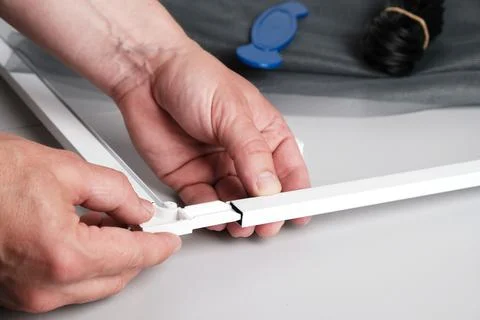 Assembling  mosquito net for  window Fotos de archivo