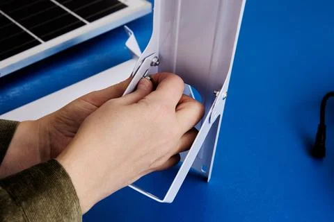 Assembling mounting bracket for an autonomous solar street light. Stock Photos