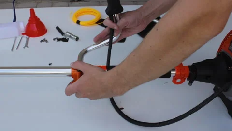 Assembling a new brushcutter with your own hands Stock Footage 327891171
