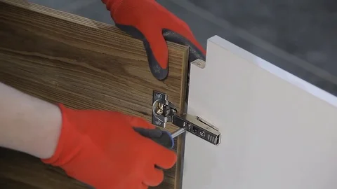 Assembling new furniture with a screwdriver Stock Footage 71618679