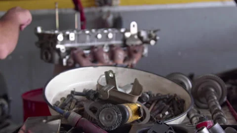 Assembling Parts of Overhauled Car Engine in the Repair Shop 3 Stock Footage 198970758