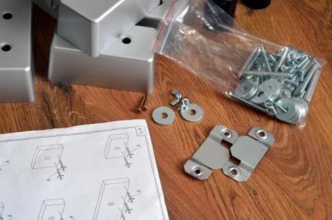 Assembling parts of sofa with instruction Stock Photos