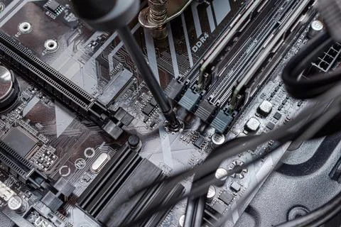 Assembling a personal computer processor connecting wires in a service. Upgra 写真素材