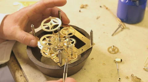 Assembling a radar work of an old antique clock, close up Stock Footage 49937300