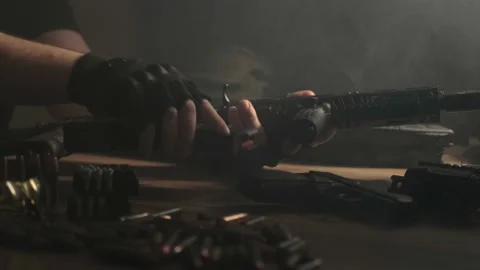 Assembling the rifle. Ammunition. Preparation. Close. Stock Footage 230940396