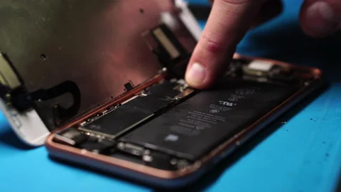 Assembling Smartphone After Repair and Changing Lithium-Ion Battery, Close Stock Footage 235151756
