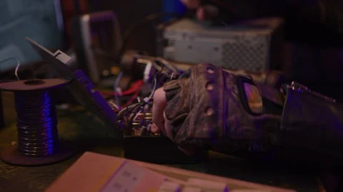 Assembling the  spying device in secret basement Stock Footage 128544787