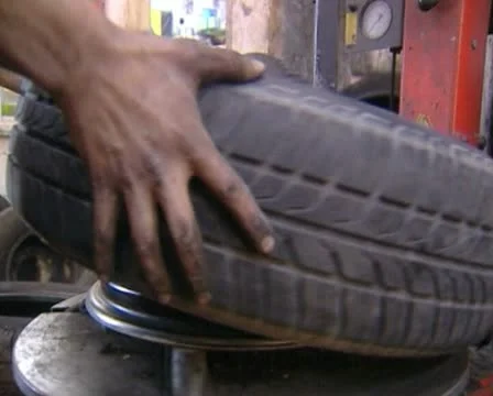 Assembling a tire Stock Footage 20506343