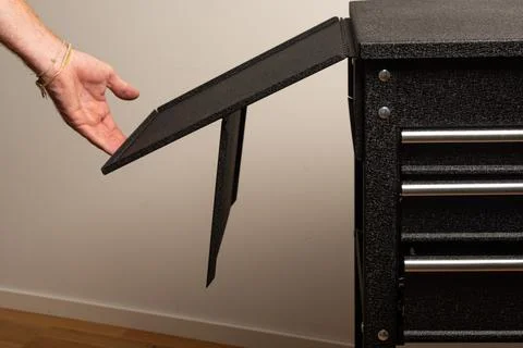 Assembling tool chest with panels and screws Stock Photos