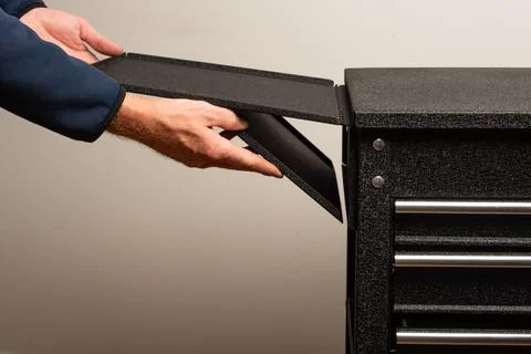 Assembling tool chest with panels and screws Stock Photos