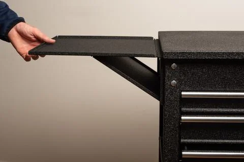 Assembling tool chest with panels and screws Stock Photos